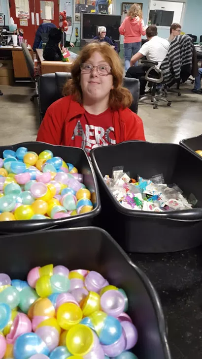 woman working on easter egg assembly