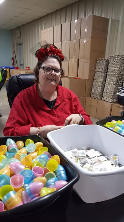 woman working on easter egg assembly