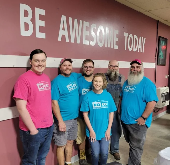 group picture of the plant and yard staff with "be awesome today" on the wall in the background