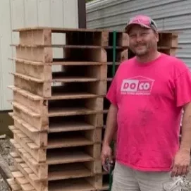 james baily by a stack of pallets
